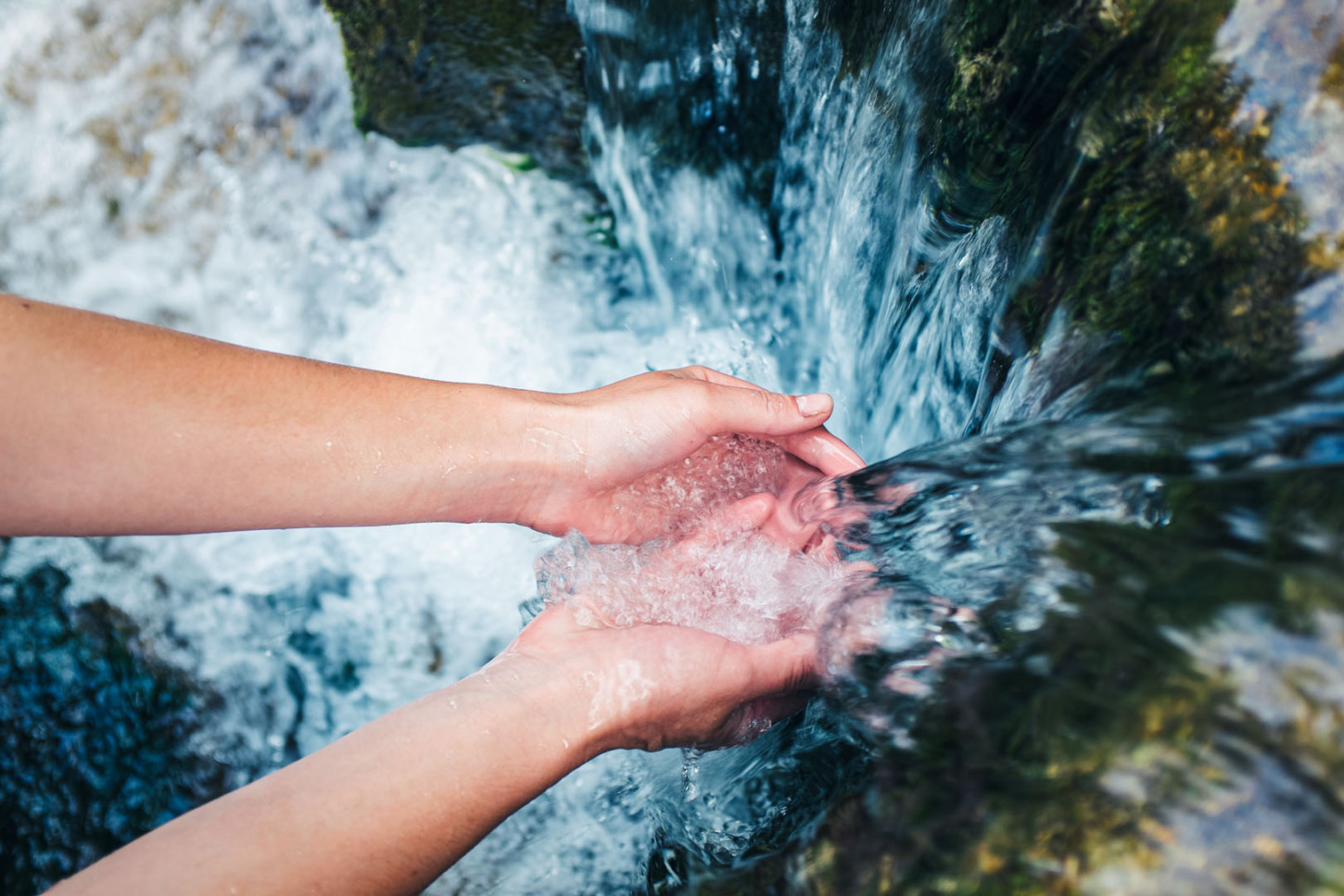 womans-hands-with-water-splash-3